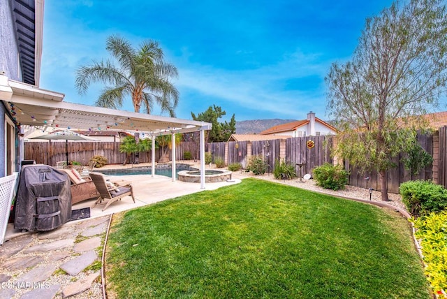 view of yard with a pool with hot tub and a patio