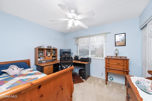 bedroom with light carpet, a closet, and ceiling fan