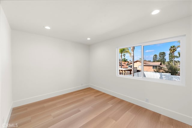 empty room featuring hardwood / wood-style floors