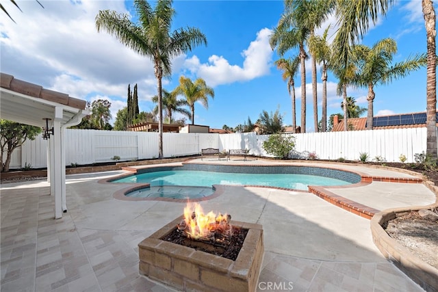 view of pool featuring a patio area and an outdoor fire pit