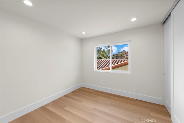 empty room with light wood-type flooring