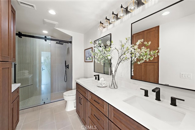 bathroom with tile patterned floors, vanity, toilet, and an enclosed shower