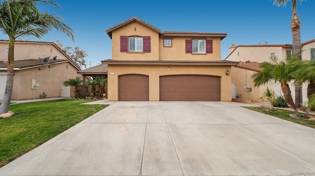 view of front facade featuring a garage and a front lawn