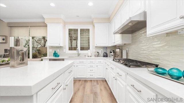 kitchen with white cabinetry and sink