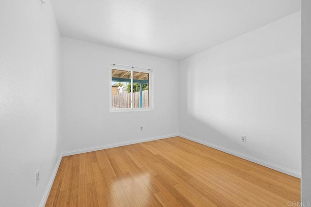 spare room featuring light hardwood / wood-style flooring