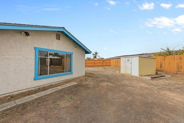 view of home's exterior featuring a storage unit