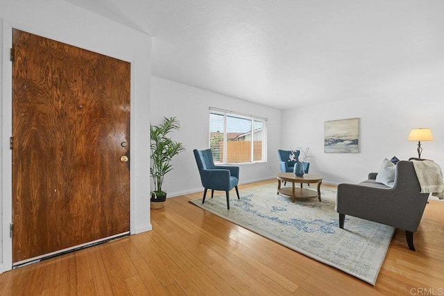 sitting room with light hardwood / wood-style flooring