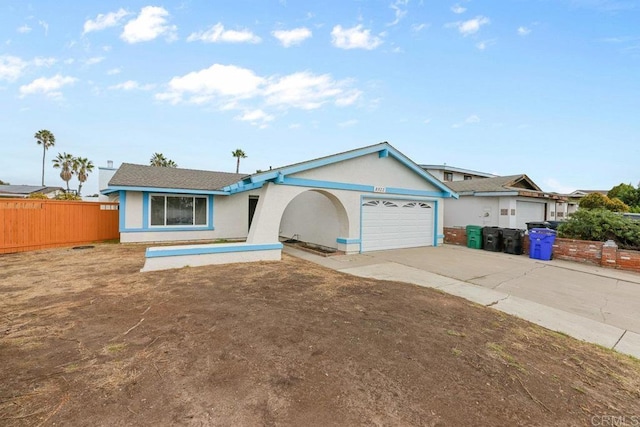 ranch-style house featuring a garage