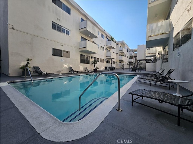 view of swimming pool featuring a patio