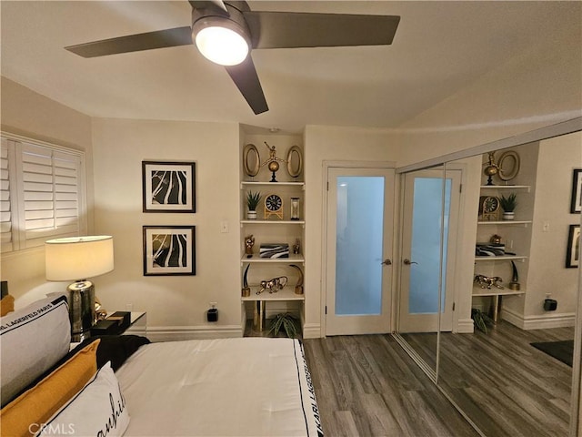 bedroom with dark wood-type flooring and ceiling fan