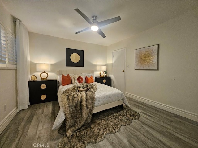 bedroom featuring ceiling fan and dark hardwood / wood-style flooring