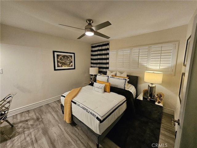 bedroom featuring ceiling fan and wood-type flooring