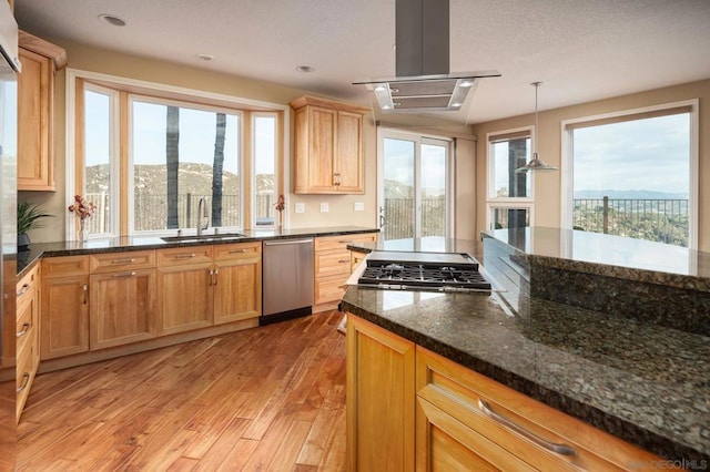 kitchen featuring island range hood, decorative light fixtures, dishwasher, sink, and light hardwood / wood-style floors