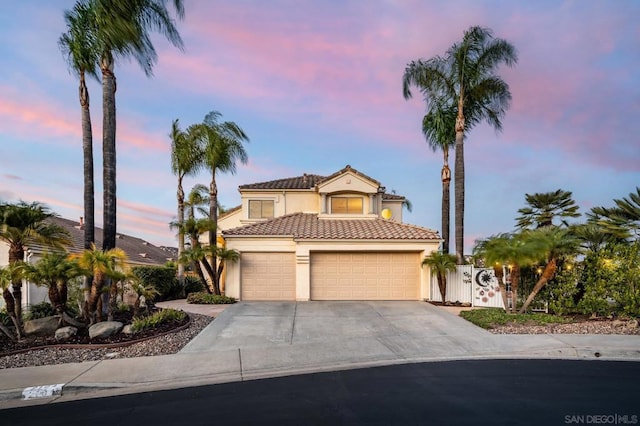 mediterranean / spanish-style house featuring a garage