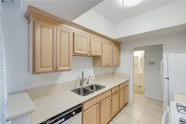 kitchen featuring white appliances, light brown cabinetry, sink, and light tile patterned floors