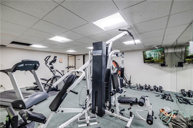 workout area with a paneled ceiling