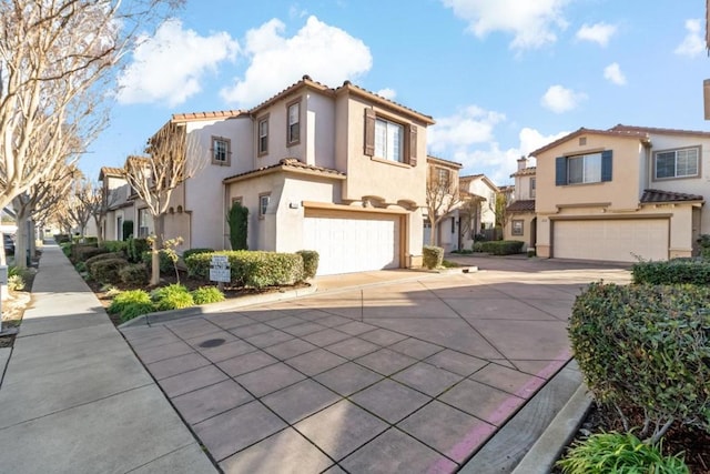 mediterranean / spanish-style house featuring a garage