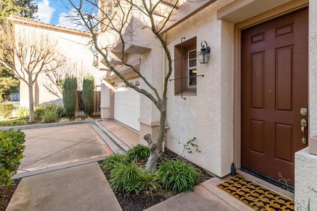 property entrance with a garage