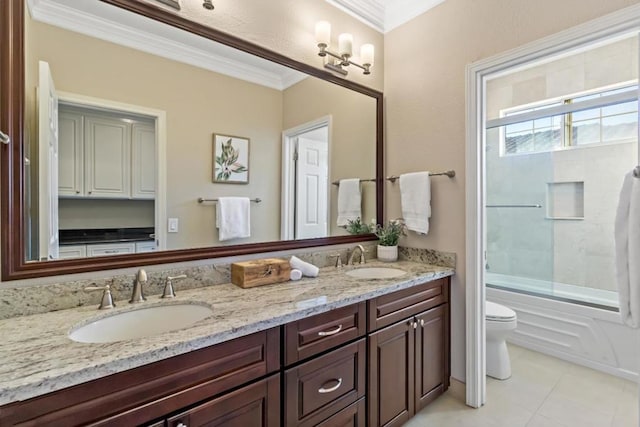 full bathroom with toilet, combined bath / shower with glass door, ornamental molding, vanity, and tile patterned flooring