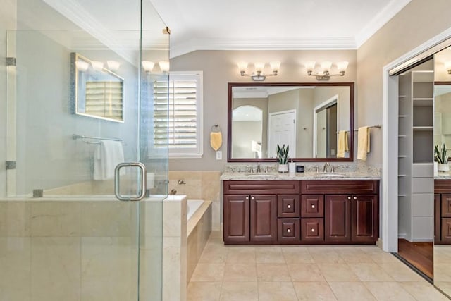 bathroom featuring tile patterned flooring, crown molding, separate shower and tub, and vanity