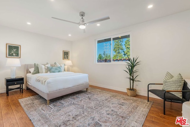 bedroom featuring hardwood / wood-style floors and ceiling fan