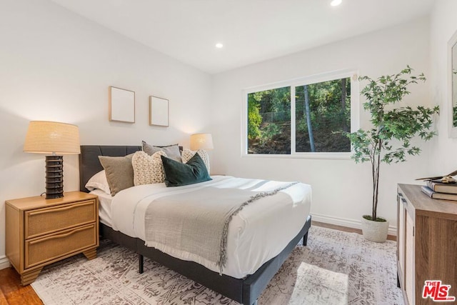 bedroom with light wood-type flooring