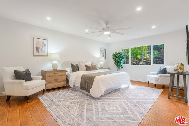 bedroom featuring hardwood / wood-style flooring and ceiling fan