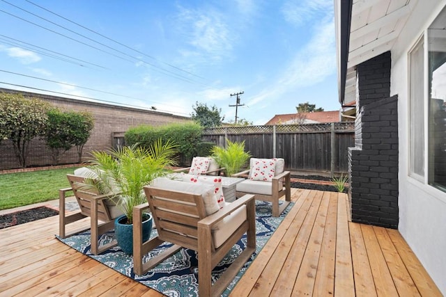 wooden deck with an outdoor living space