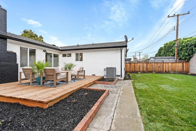 back of house with outdoor lounge area, cooling unit, a deck, and a lawn