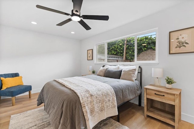 bedroom featuring light hardwood / wood-style floors and ceiling fan