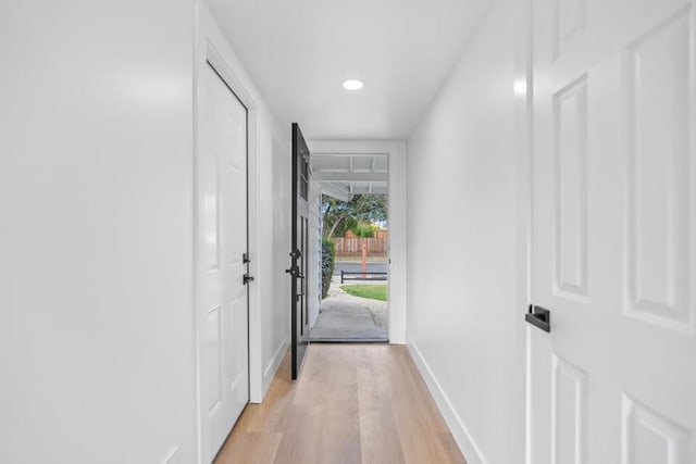 doorway with light hardwood / wood-style flooring