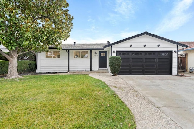 ranch-style house featuring a garage and a front yard