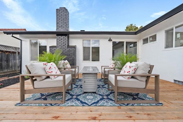 wooden deck featuring an outdoor living space