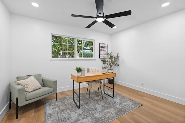 office area with hardwood / wood-style flooring and ceiling fan