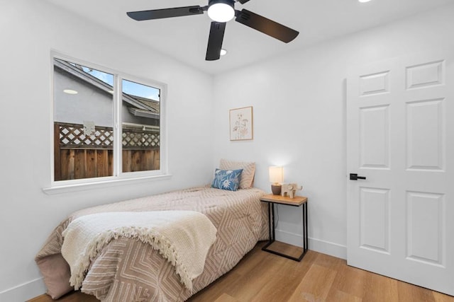 bedroom featuring light hardwood / wood-style floors and ceiling fan