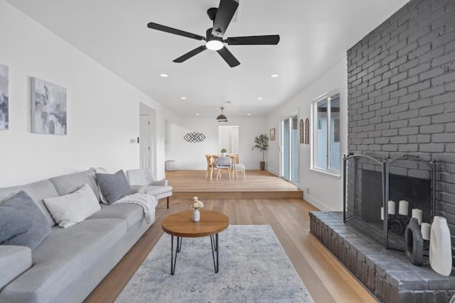 living room featuring a fireplace and light hardwood / wood-style floors