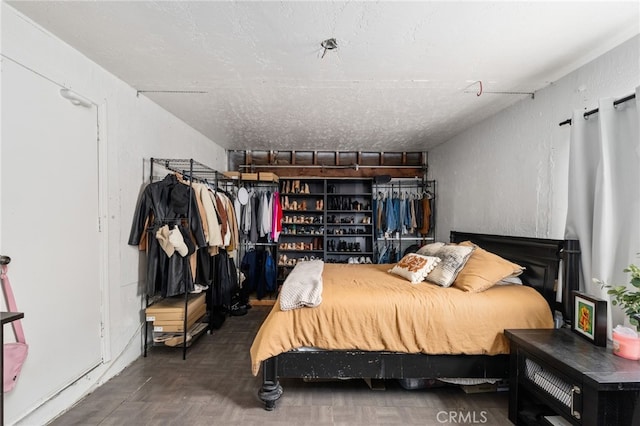 bedroom featuring parquet flooring