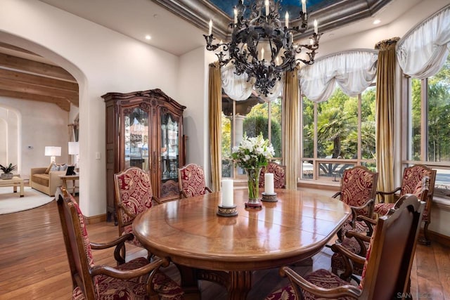 dining room featuring hardwood / wood-style flooring and a chandelier