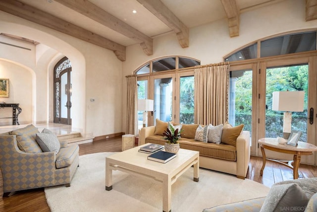 living room with hardwood / wood-style flooring and beamed ceiling