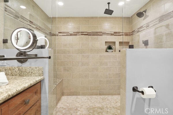 bathroom with vanity and a walk in shower