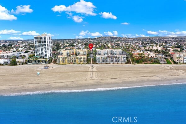 bird's eye view featuring a view of city, a beach view, and a water view