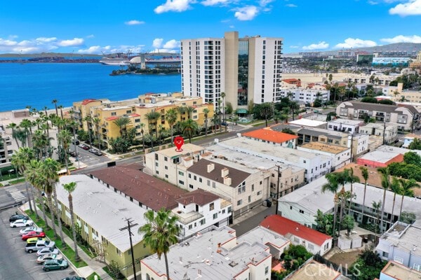 drone / aerial view with a water view and a view of city