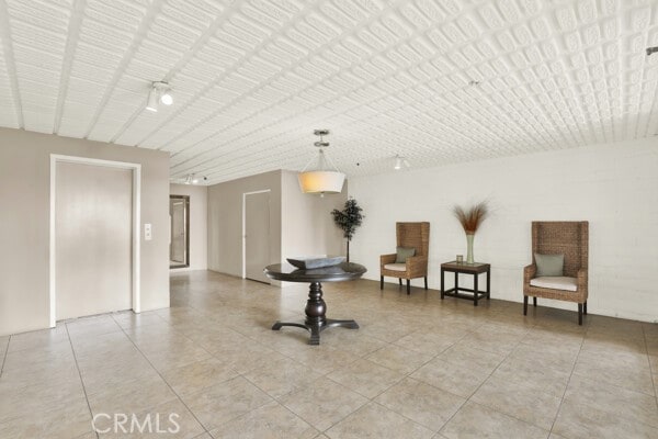 living area featuring light tile patterned floors