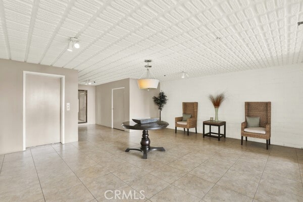 interior space with light tile patterned floors