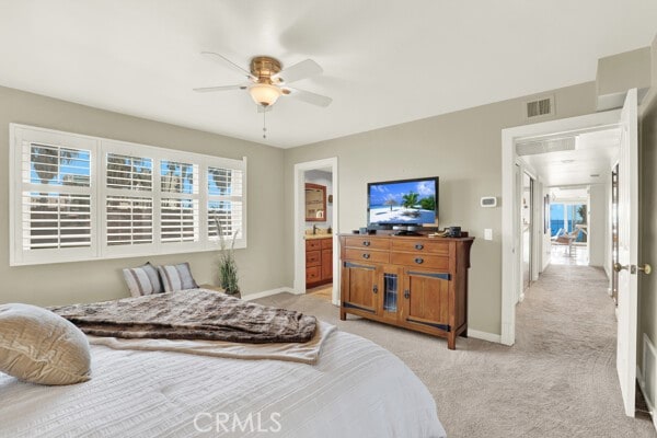 bedroom featuring light carpet and ceiling fan