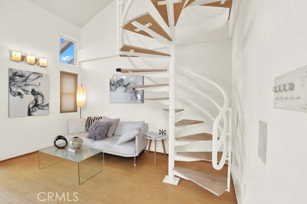 stairway with hardwood / wood-style floors