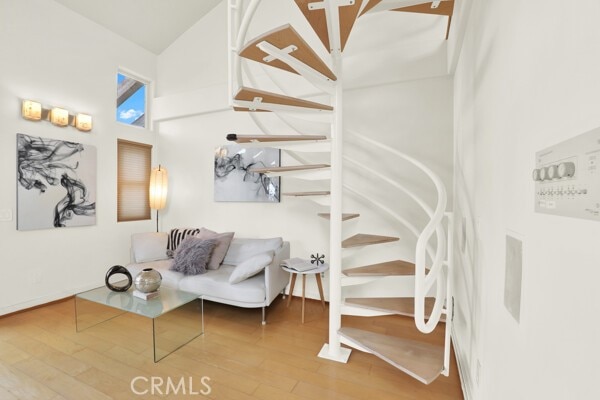 interior space featuring stairway and wood finished floors