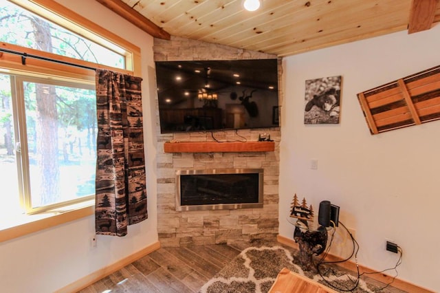 living room featuring wood ceiling, lofted ceiling, a fireplace, and hardwood / wood-style floors