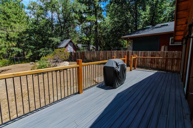 wooden deck with grilling area