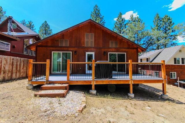 rear view of property with a deck